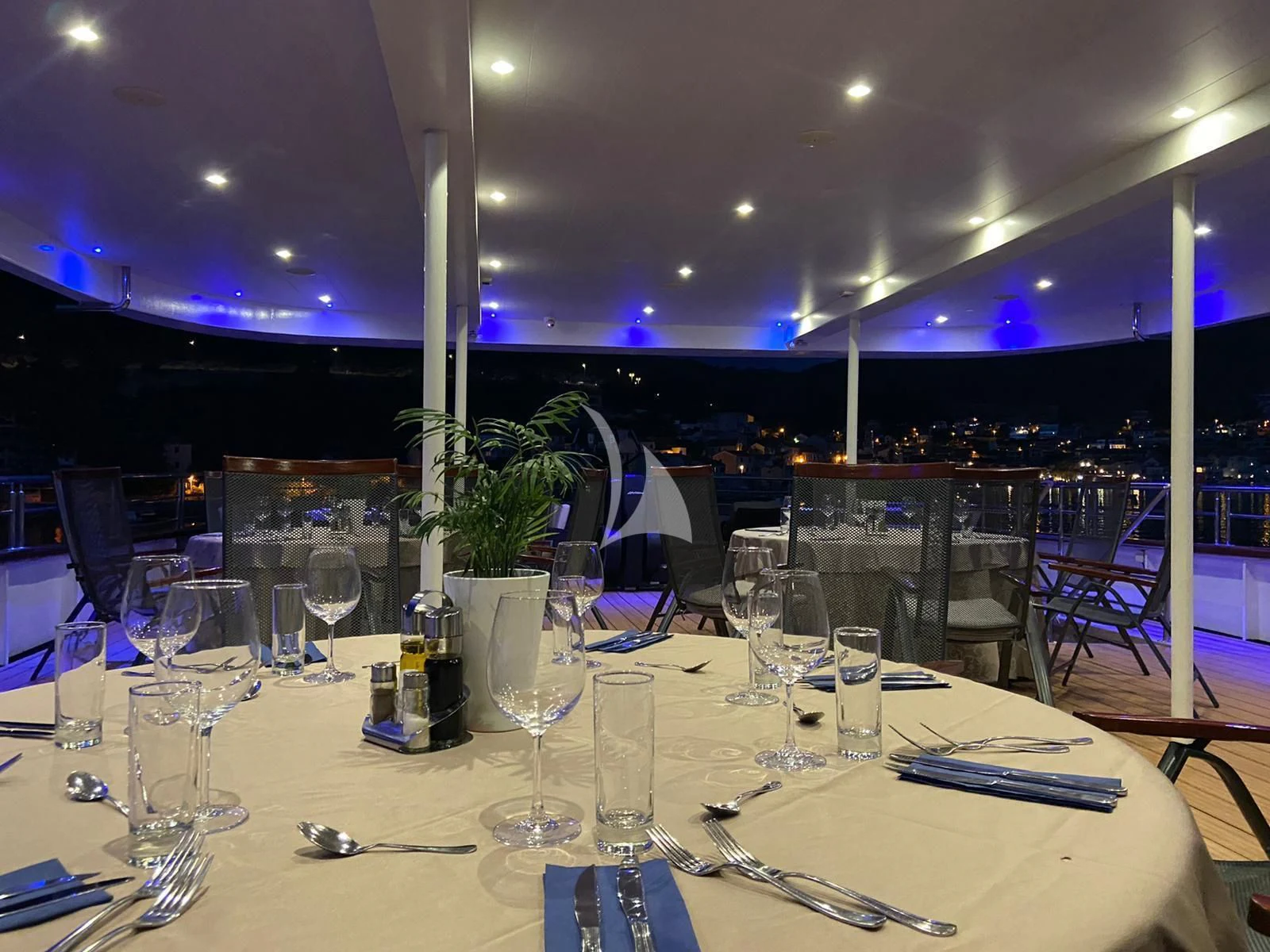 a table with empty wine glasses aboard QUEEN ELEGANZA Yacht for Sale