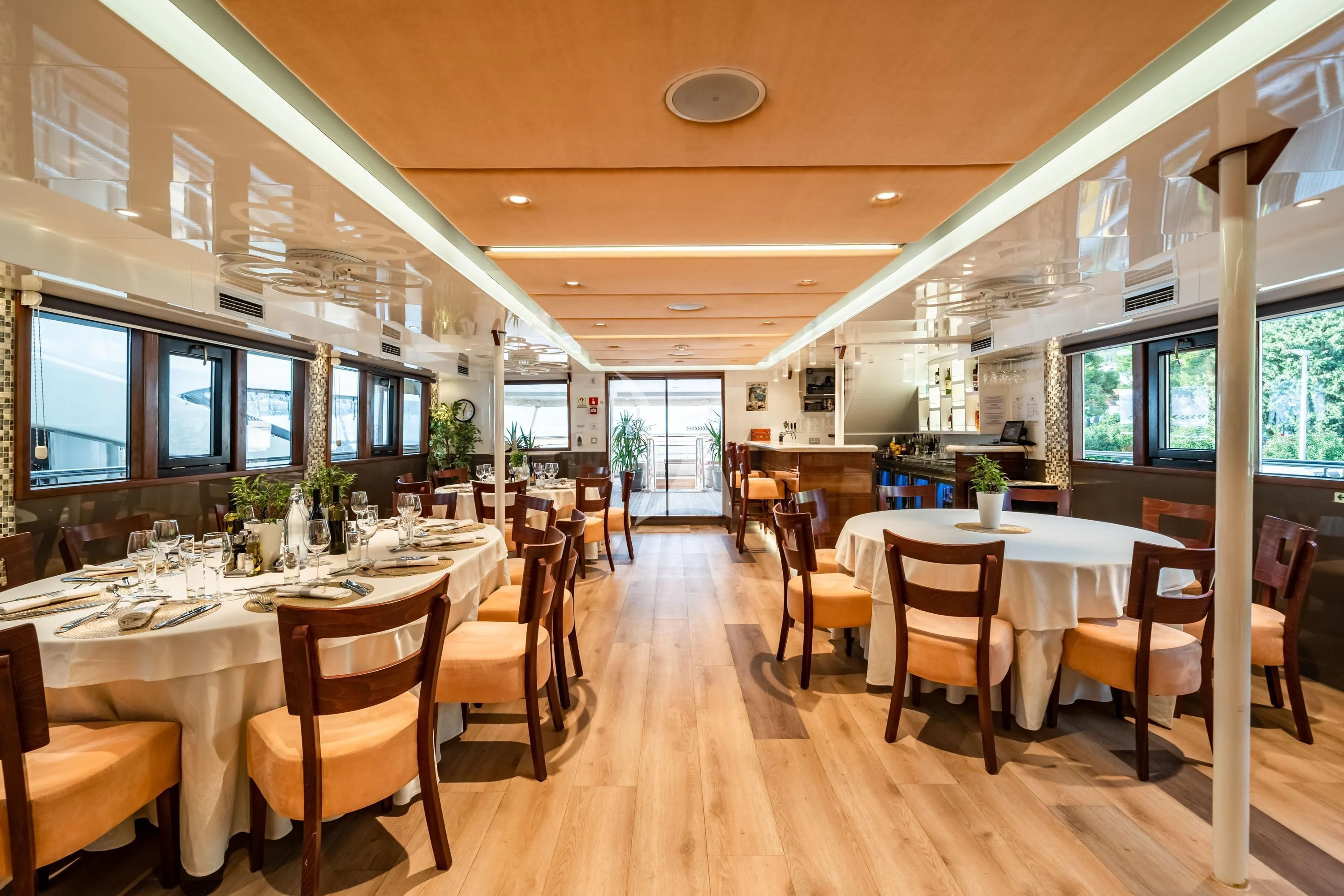 a room with tables and chairs aboard QUEEN ELEGANZA Yacht for Sale