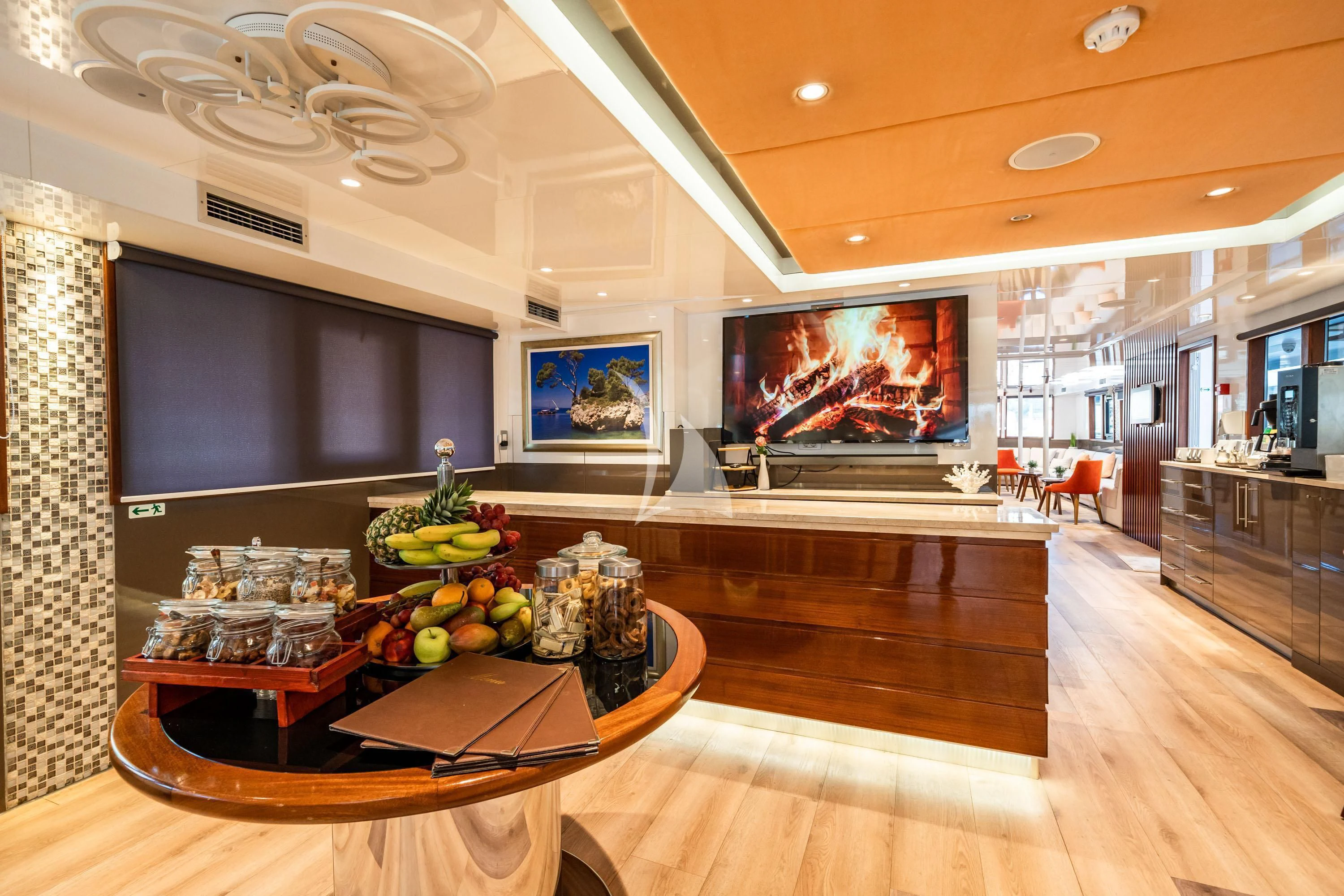 a large kitchen with a large screen aboard QUEEN ELEGANZA Yacht for Sale