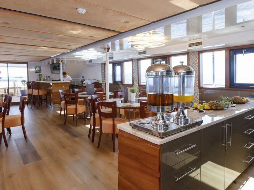 a kitchen with a large glass coffee maker and a large glass coffee maker aboard QUEEN ELEGANZA Yacht for Sale