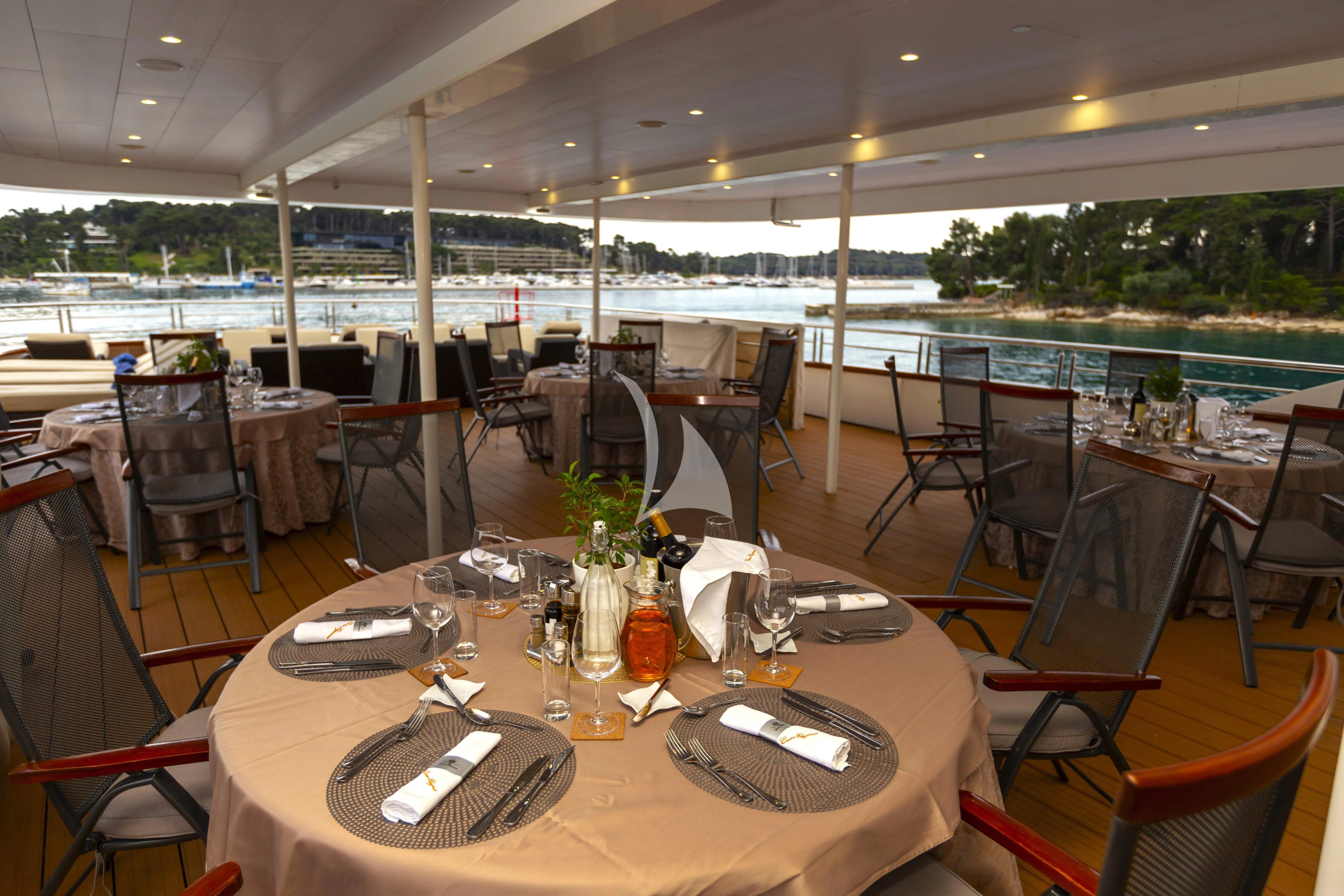 a table set for a meal aboard QUEEN ELEGANZA Yacht for Sale