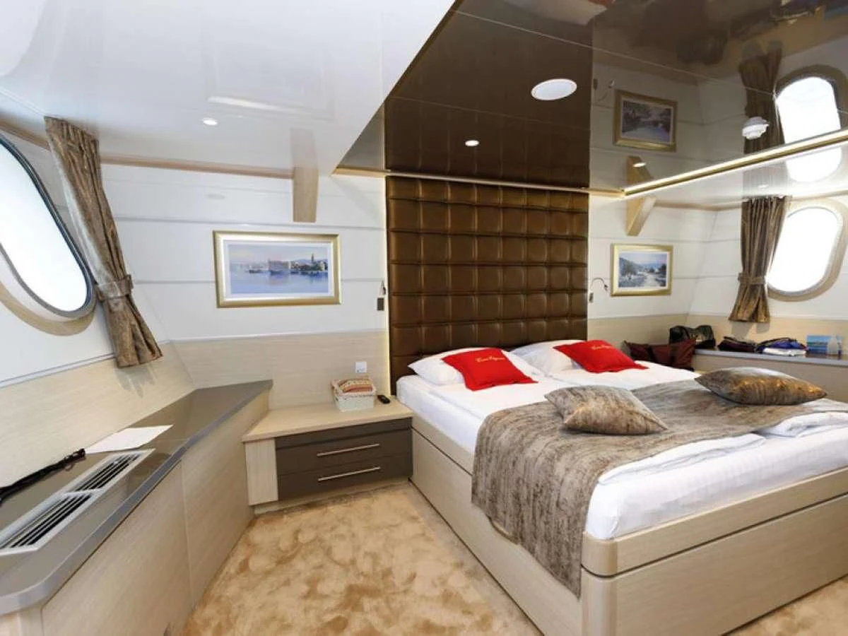 a room with two beds aboard QUEEN ELEGANZA Yacht for Sale