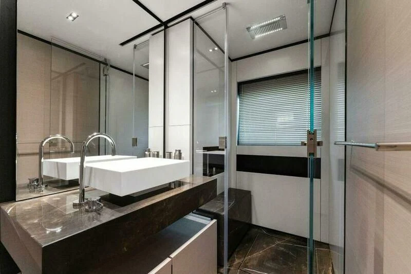 a bathroom with a sink and a mirror aboard OFFICIAL PLAN Yacht for Sale