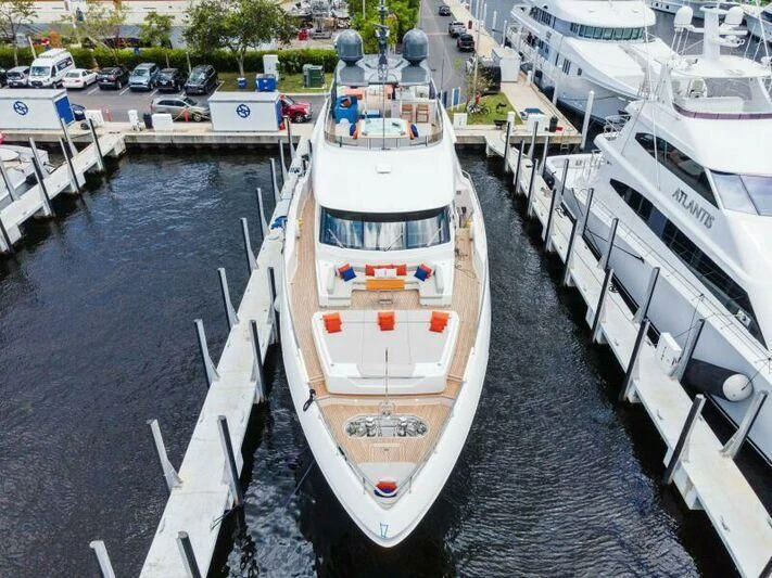 a boat is parked on the side of a river aboard OFFICIAL PLAN Yacht for Sale