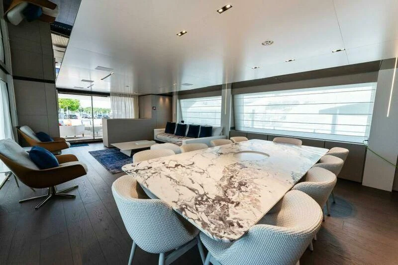 a large dining room with a large table and chairs aboard OFFICIAL PLAN Yacht for Sale