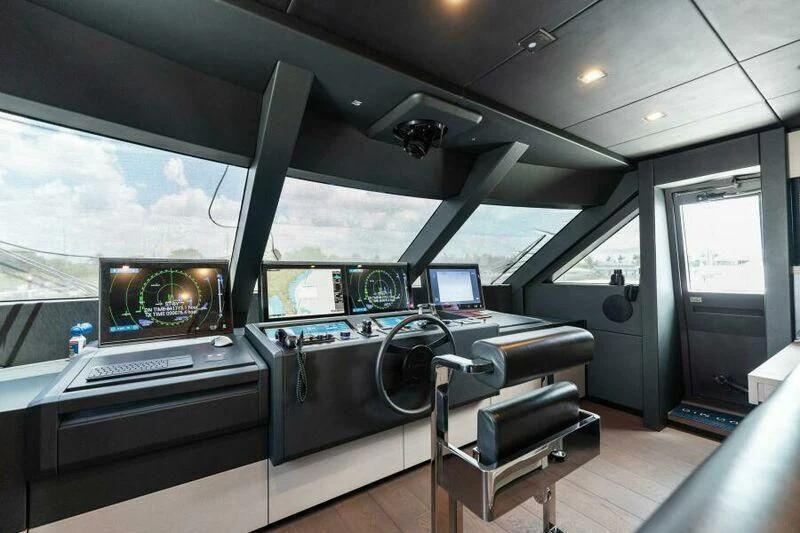 inside of a vehicle with a large window and a desk with a computer aboard OFFICIAL PLAN Yacht for Sale