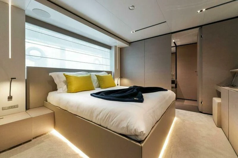 a room with a bed and a window aboard OFFICIAL PLAN Yacht for Sale