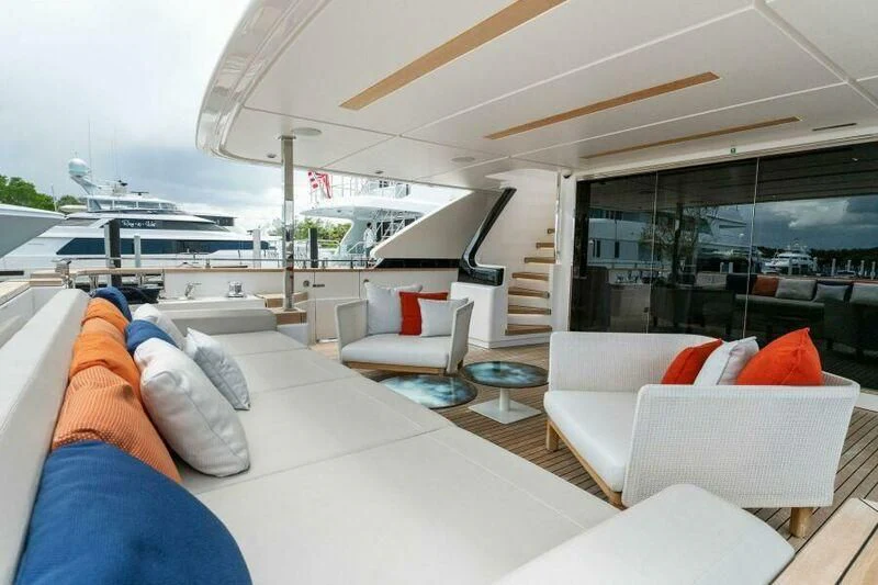 a room with a couch and a table and chairs aboard OFFICIAL PLAN Yacht for Sale