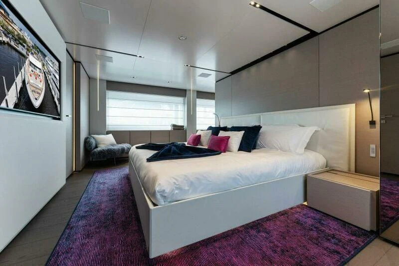a large bedroom with a large bed aboard OFFICIAL PLAN Yacht for Sale