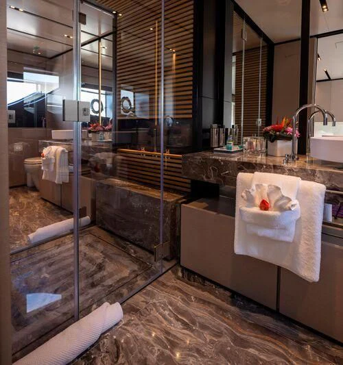 a bathroom with a large glass shower aboard OFFICIAL PLAN Yacht for Sale