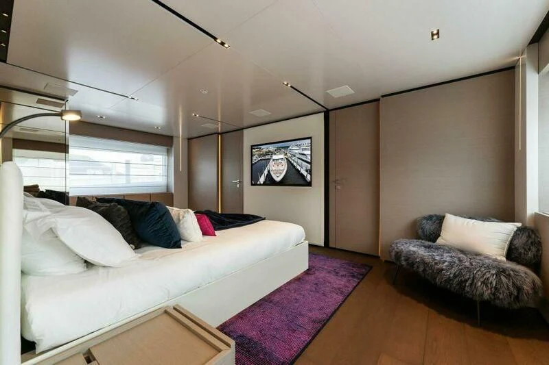 a living room with a couch and a tv aboard OFFICIAL PLAN Yacht for Sale