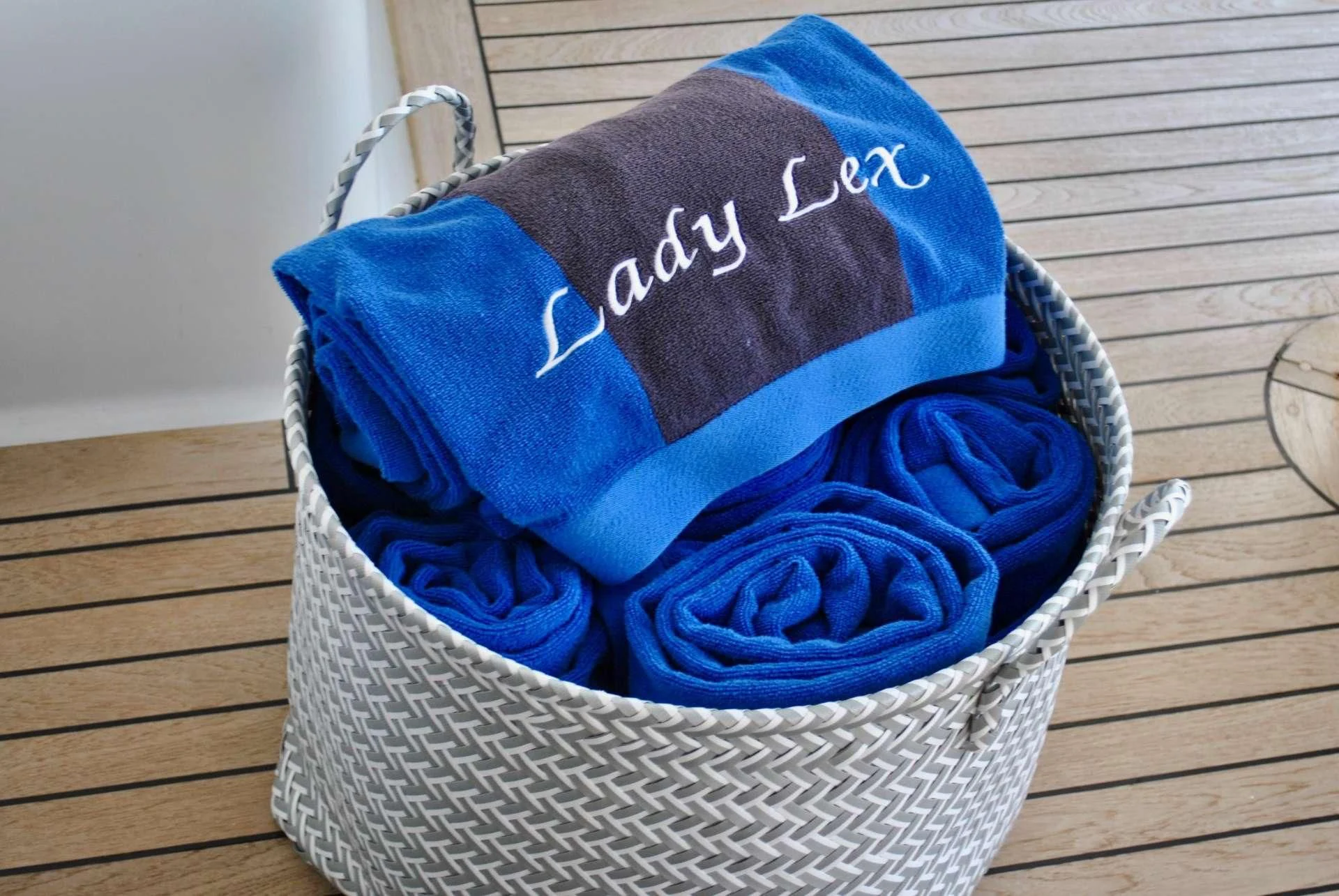a blue hat on a wicker basket aboard LADY LEX Yacht for Sale