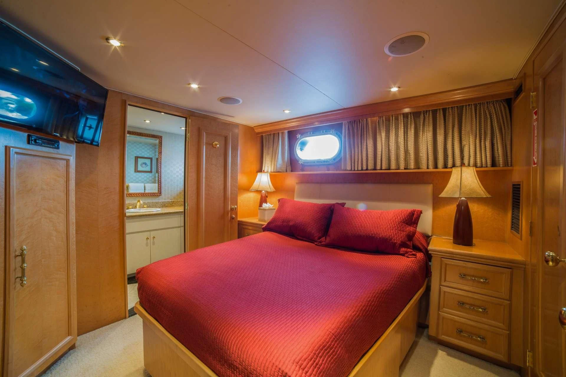 a bed in a room aboard LADY LEX Yacht for Sale