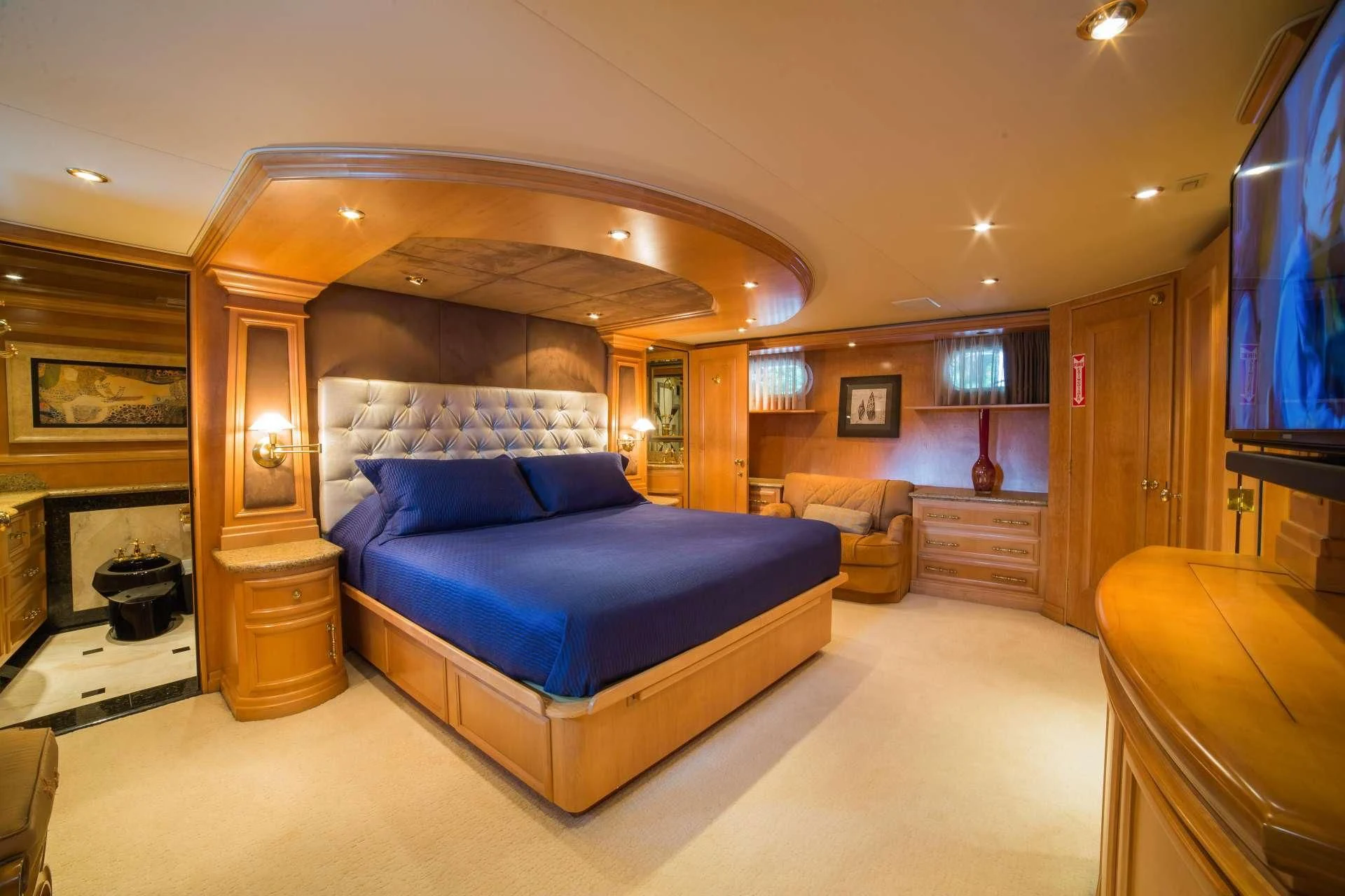 a large bedroom with a large bed aboard LADY LEX Yacht for Sale