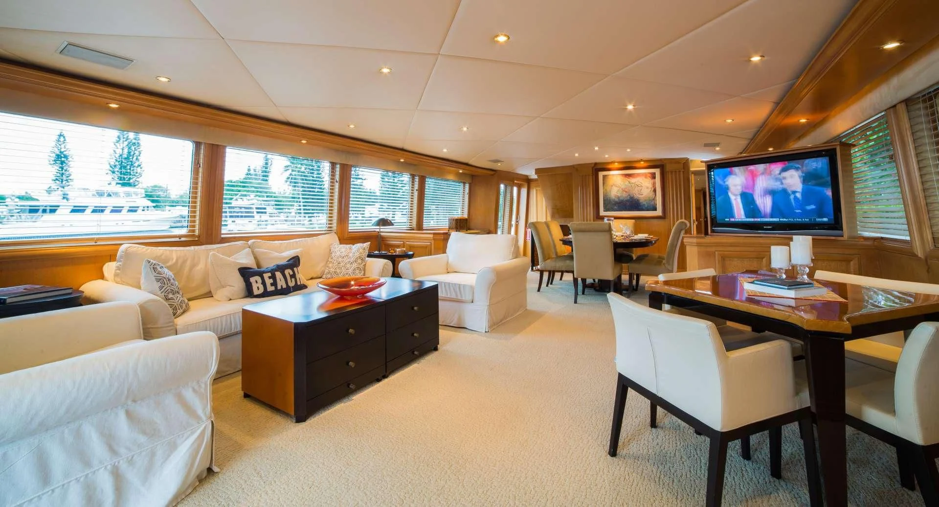 a living room with a large window aboard LADY LEX Yacht for Sale