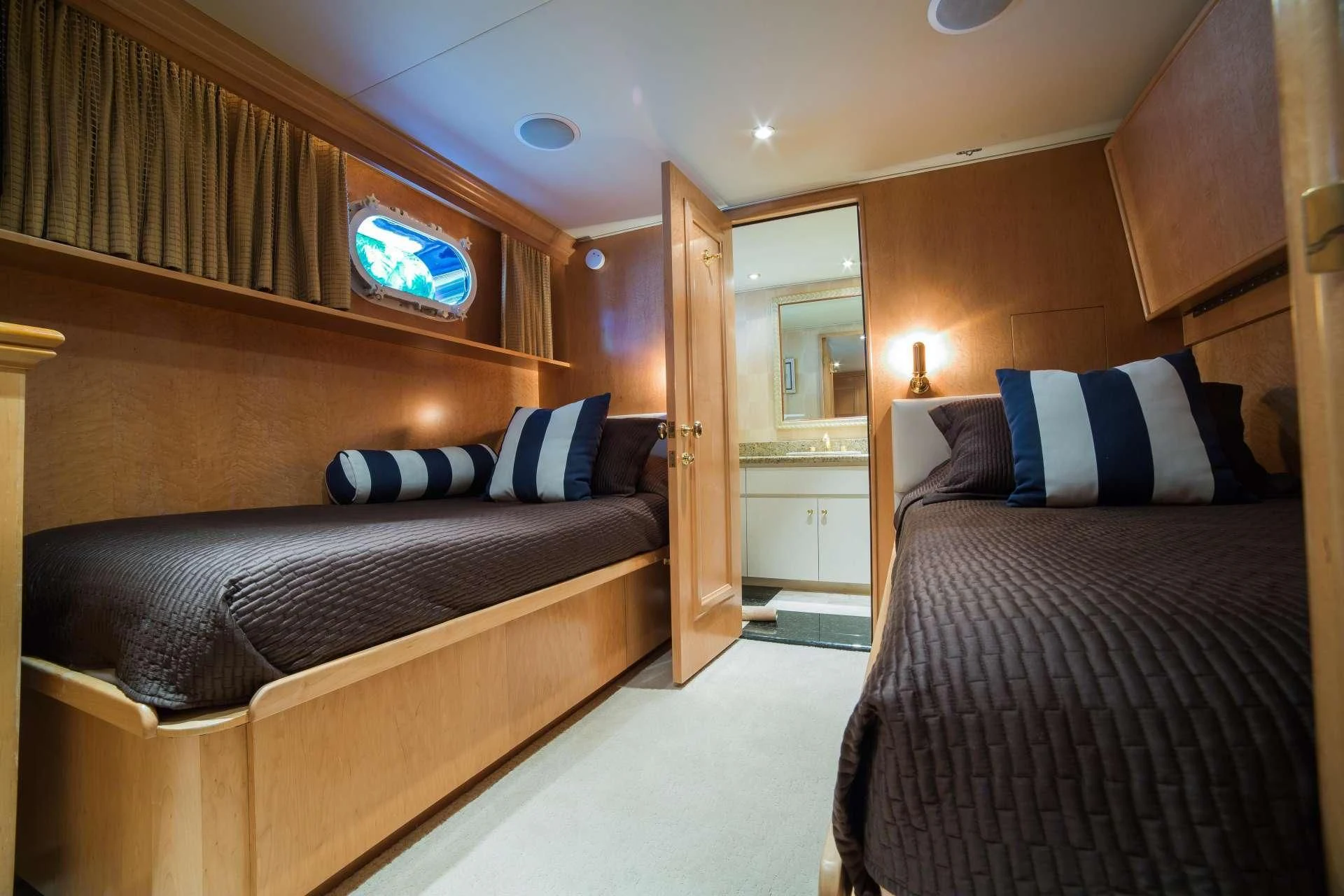 a room with two beds aboard LADY LEX Yacht for Sale