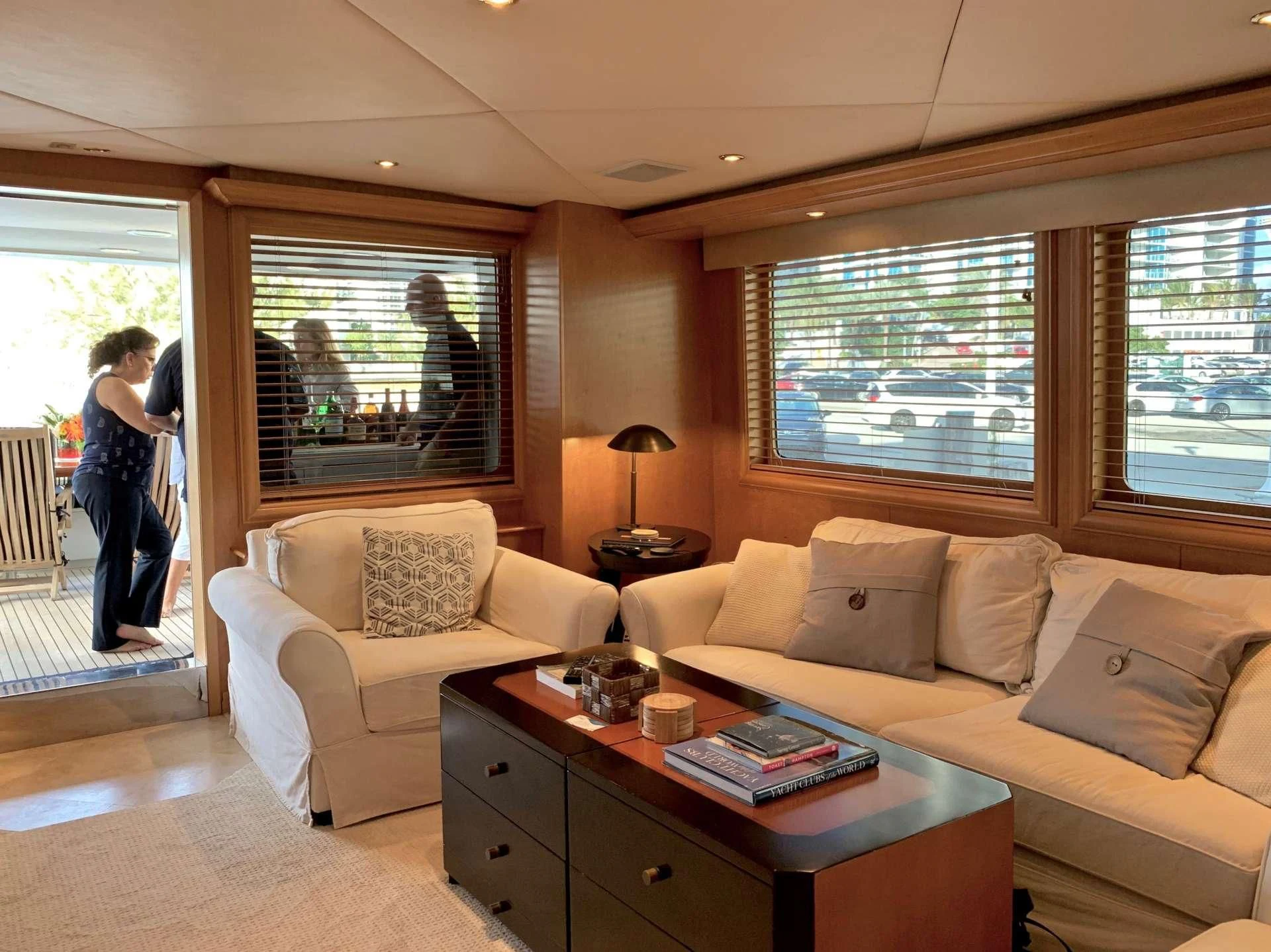 a living room with a couch and a table aboard LADY LEX Yacht for Sale