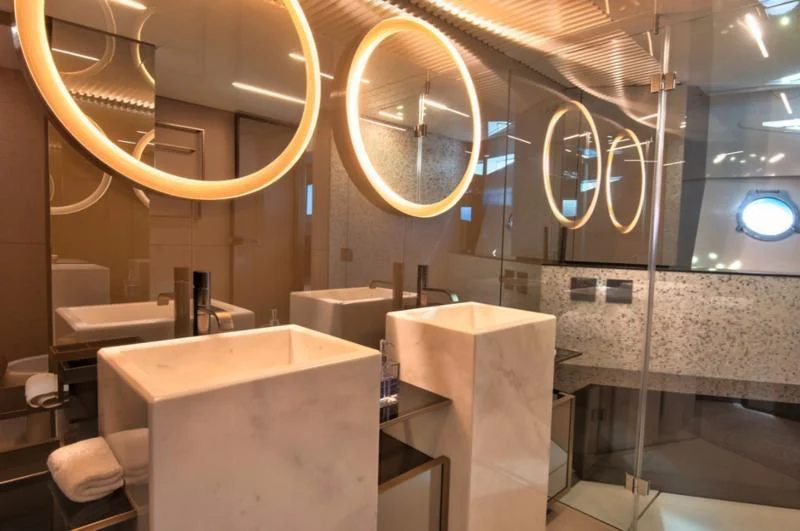 a bathroom with a large mirror aboard CIAO II Yacht for Sale