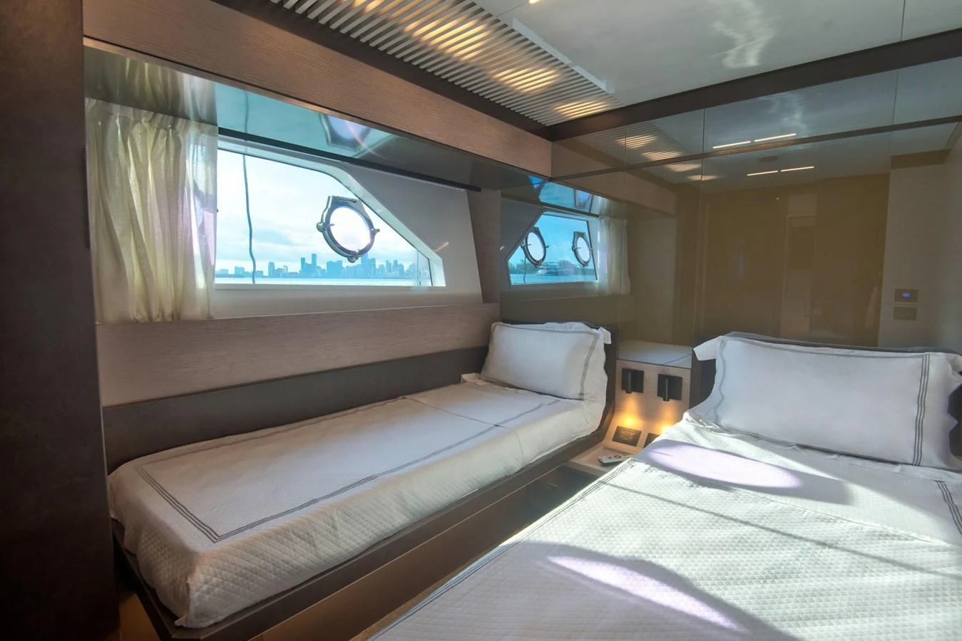 a room with two beds aboard CIAO II Yacht for Sale