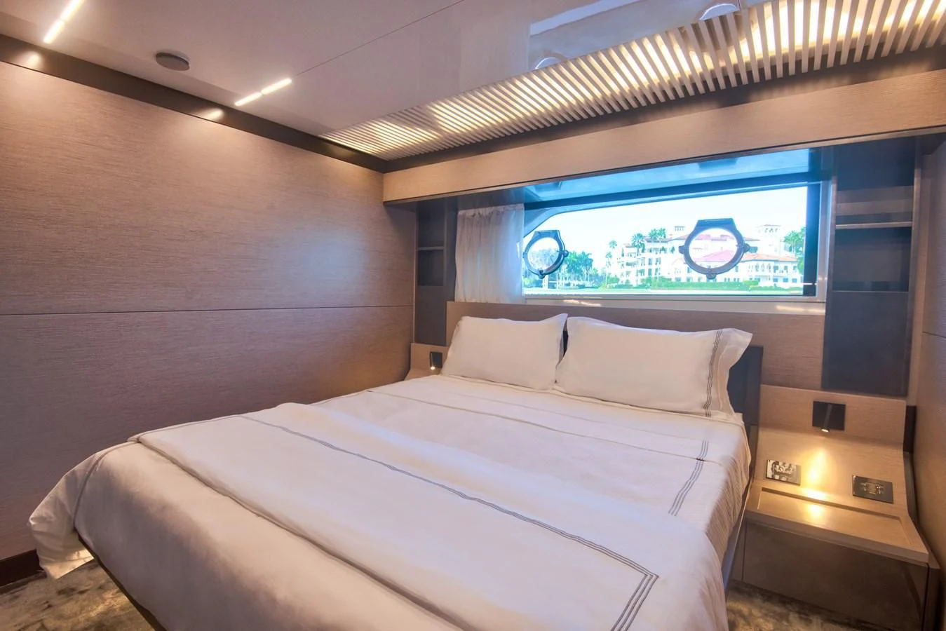 a bed with a white sheet aboard CIAO II Yacht for Sale