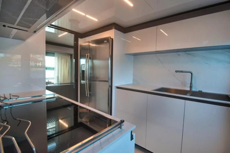 a room with a glass door and a glass wall aboard CIAO II Yacht for Sale