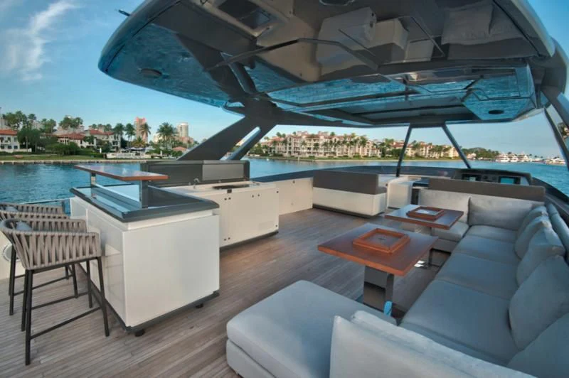 a living room with a large swimming pool aboard CIAO II Yacht for Sale