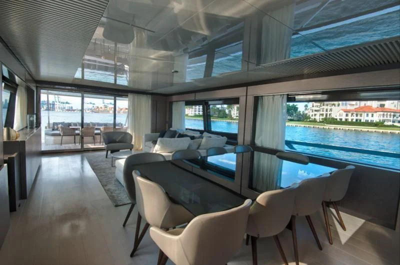 inside of a building with a large window and a view of the city aboard CIAO II Yacht for Sale