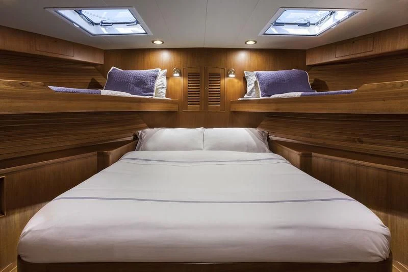 a bed with white sheets aboard VIRGINIA SEA Yacht for Sale