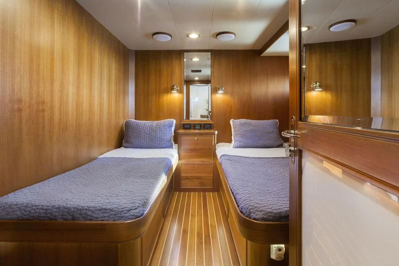 a room with a bed and a mirror aboard VIRGINIA SEA Yacht for Sale