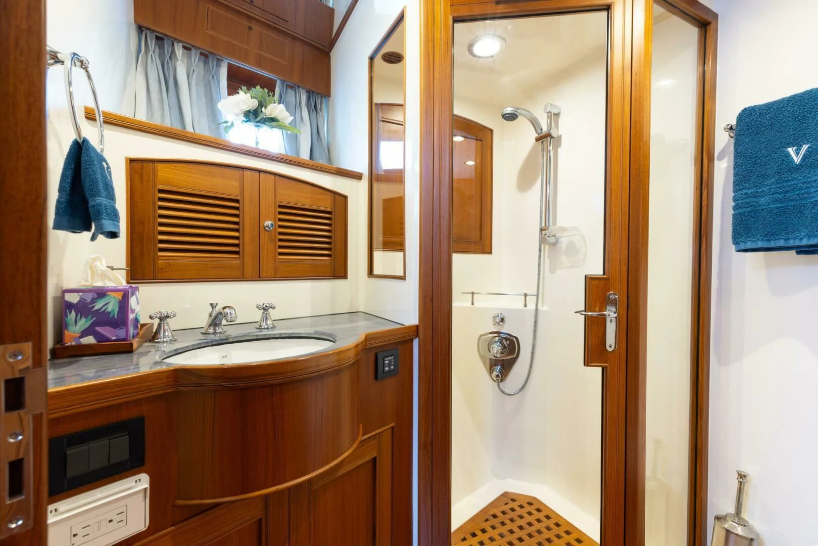 a bathroom with a sink and a shower aboard VIRGINIA SEA Yacht for Sale