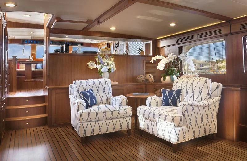 a room with a chair and a table aboard VIRGINIA SEA Yacht for Sale