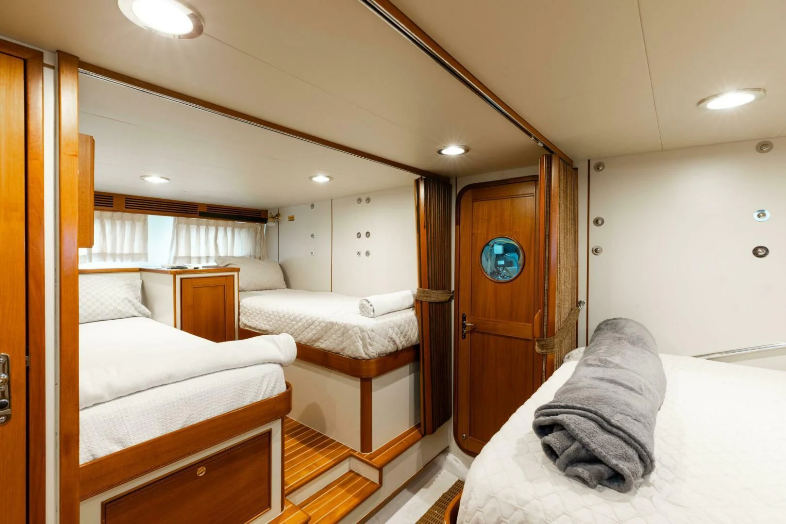 a room with a bed and a mirror aboard VIRGINIA SEA Yacht for Sale