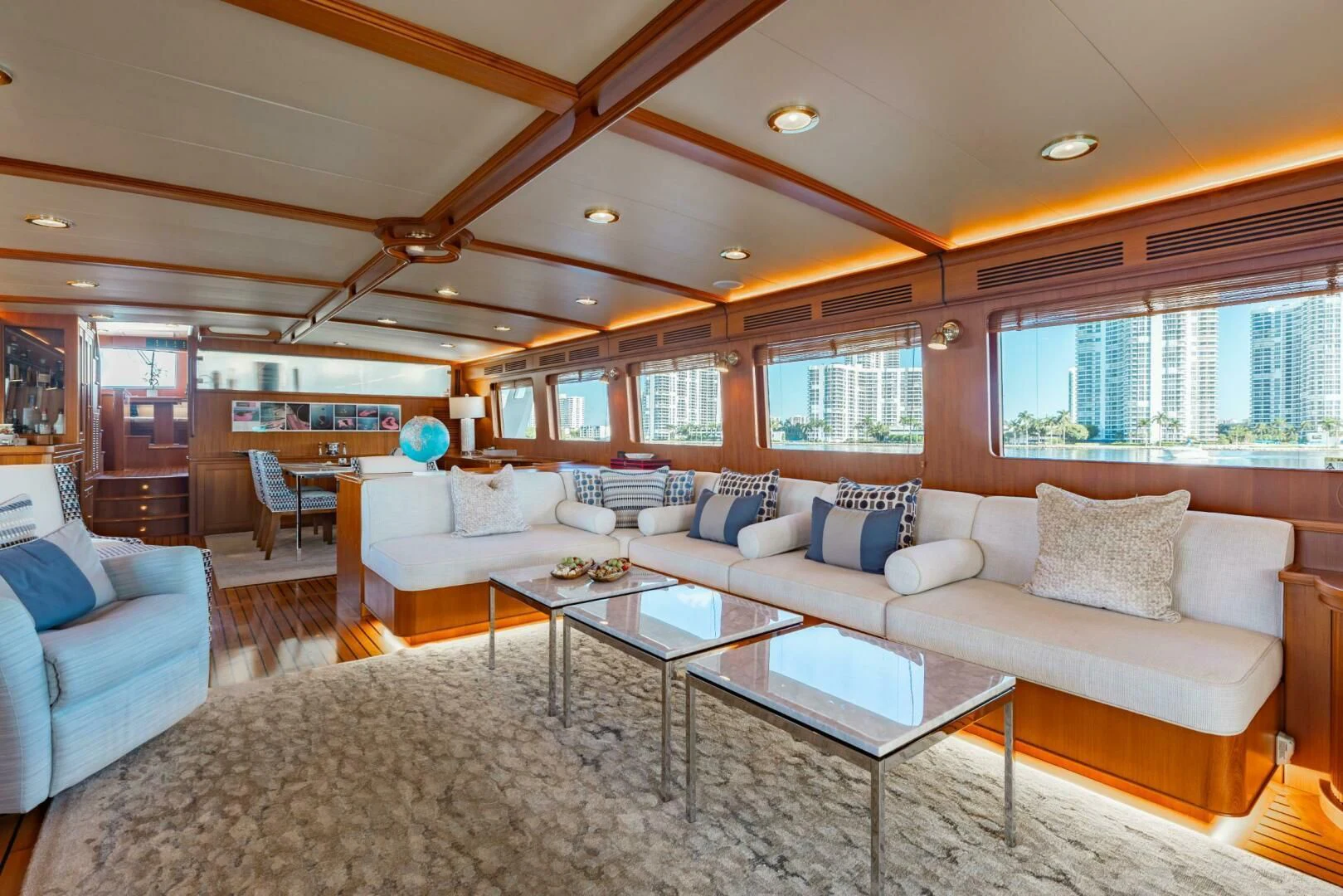 a living room with a large sofa aboard VIRGINIA SEA Yacht for Sale