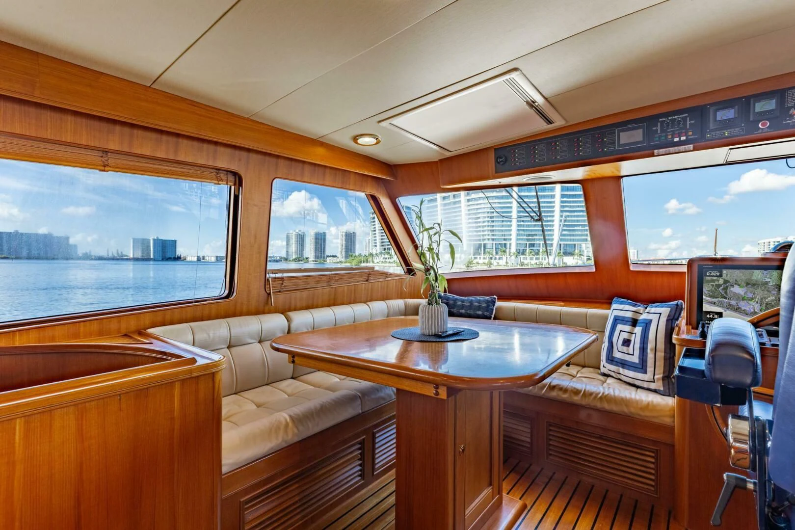 a room with a table and chairs aboard VIRGINIA SEA Yacht for Sale