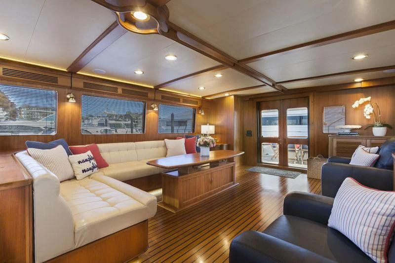 a living room with a couch and a table aboard VIRGINIA SEA Yacht for Sale