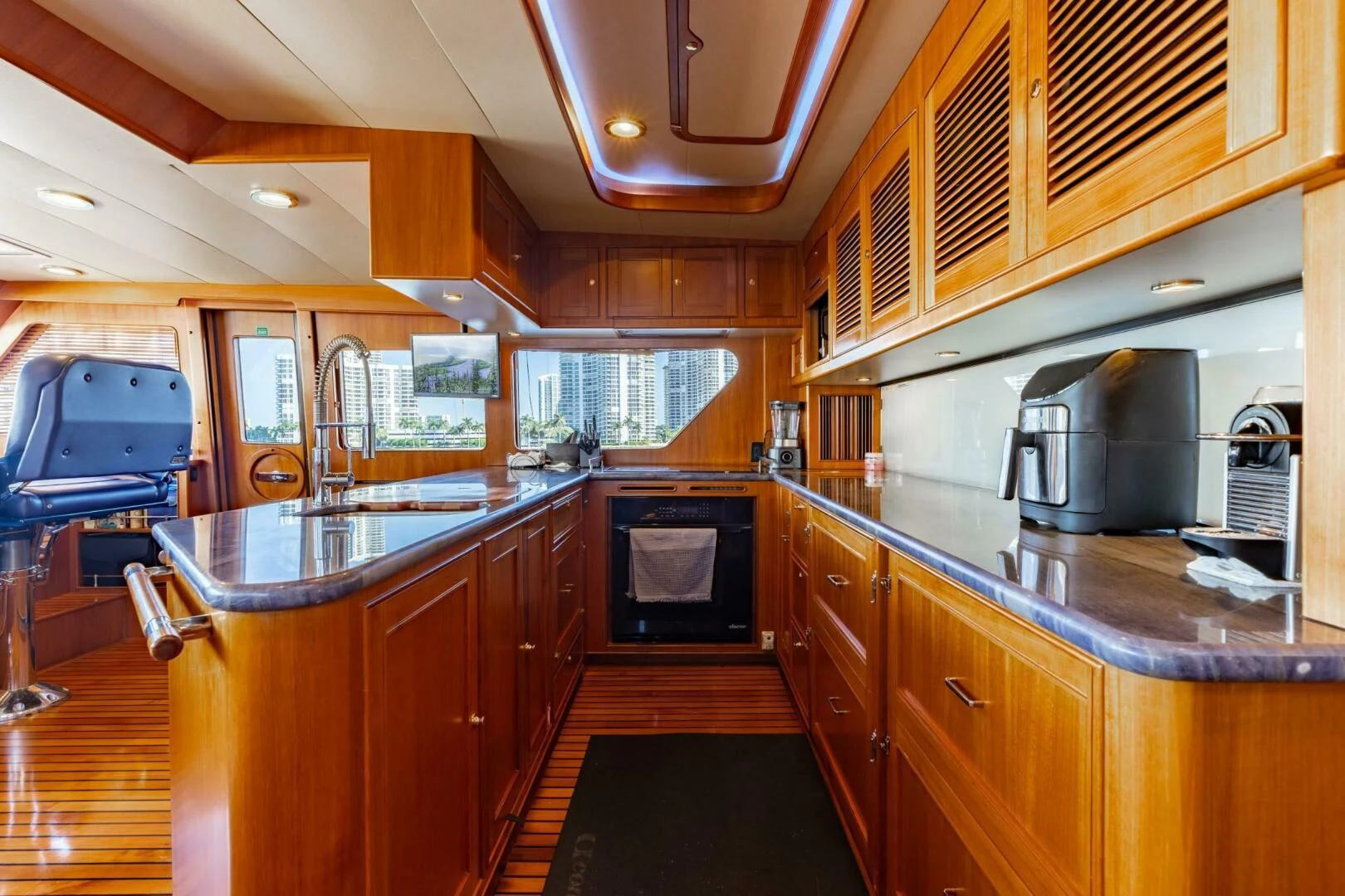 a kitchen with wooden cabinets aboard VIRGINIA SEA Yacht for Sale