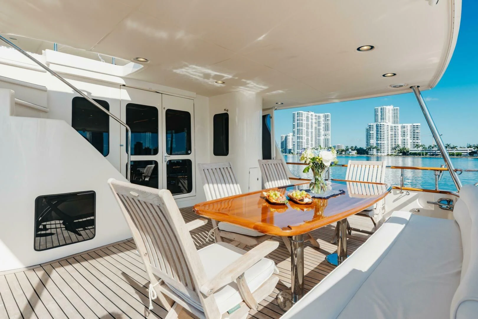 a room with a table chairs and a large window aboard VIRGINIA SEA Yacht for Sale