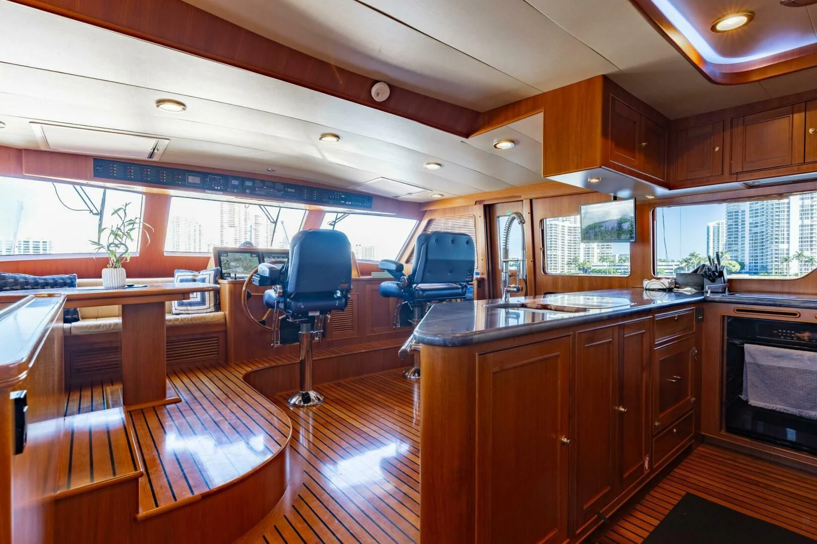 a kitchen with a bar and a deck aboard VIRGINIA SEA Yacht for Sale