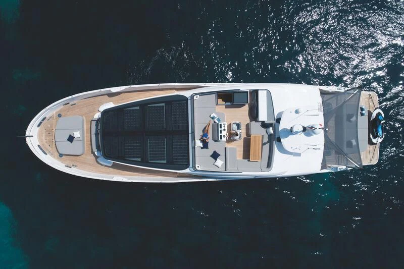 a white car with a door open aboard SONEY Yacht for Sale