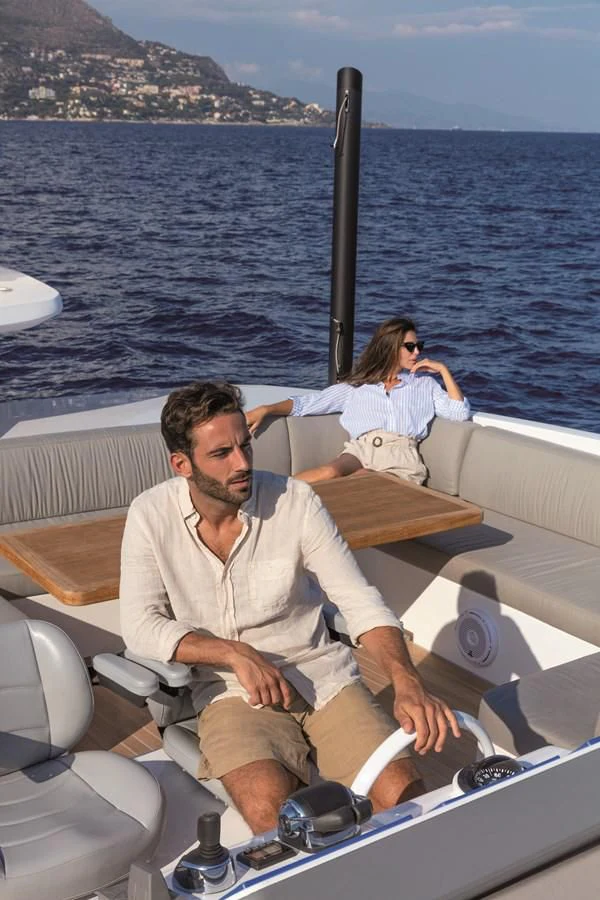 a man and woman sitting on a boat aboard SONEY Yacht for Sale