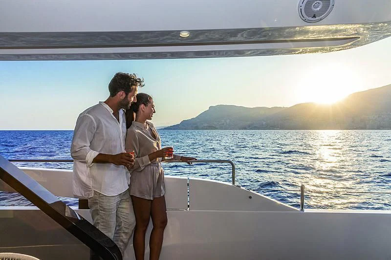 a group of people standing on a boat and looking at the water aboard SONEY Yacht for Sale