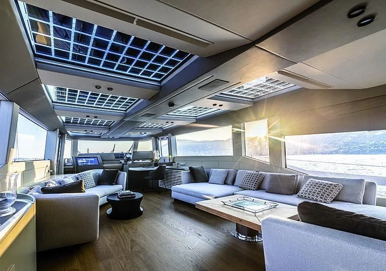 a room with a couch and a table and a large window aboard SONEY Yacht for Sale
