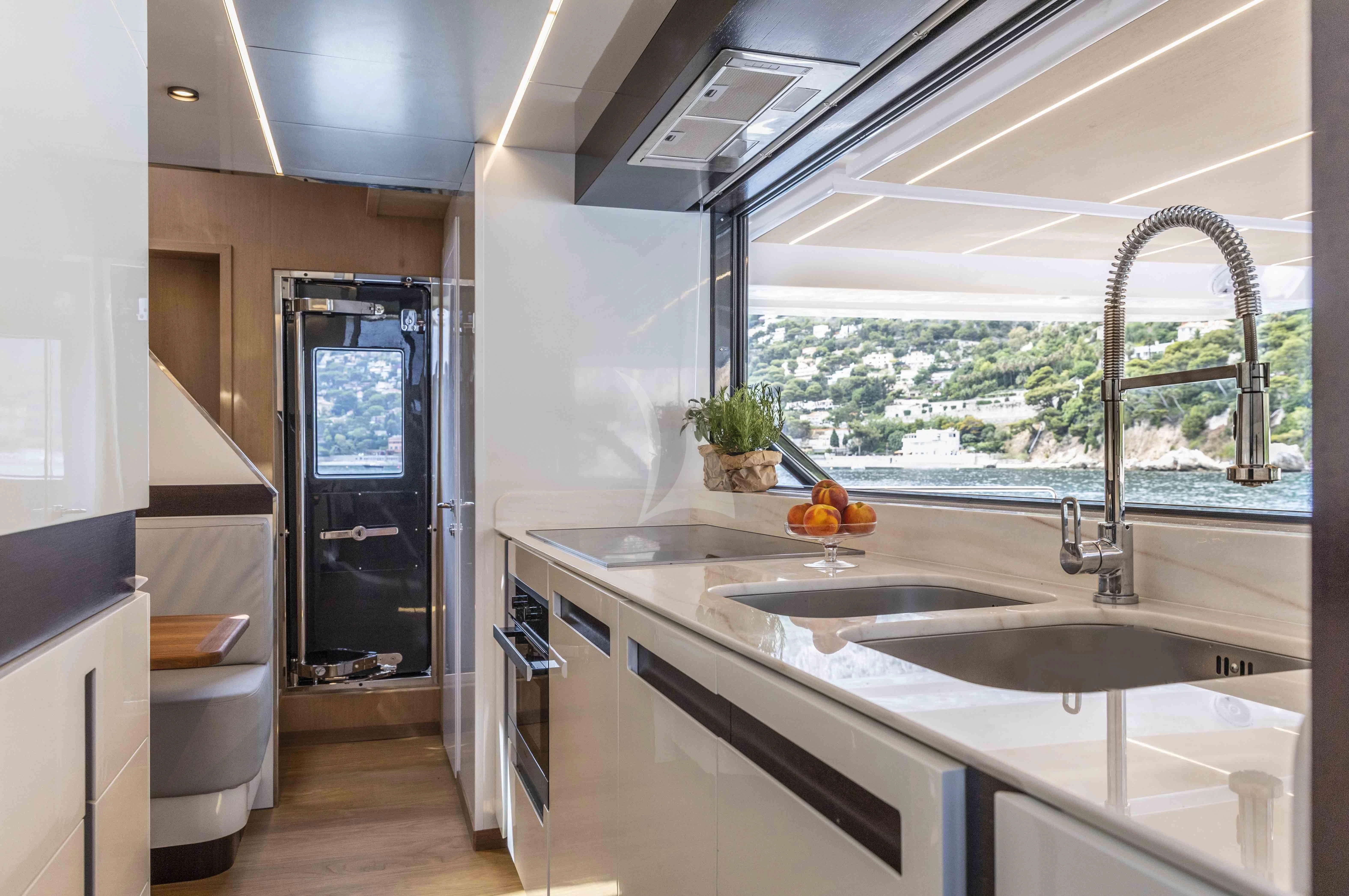 a kitchen with a large window aboard SONEY Yacht for Sale
