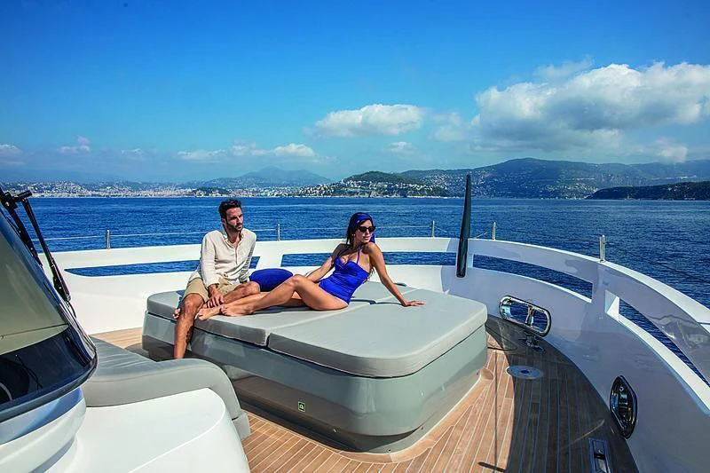a man and woman on a boat aboard SONEY Yacht for Sale