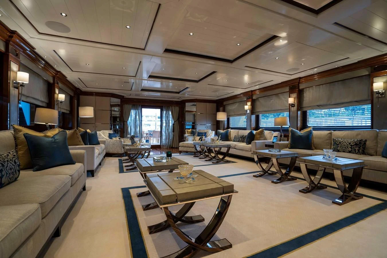 a living room with a large window aboard TACANUYA Yacht for Charter