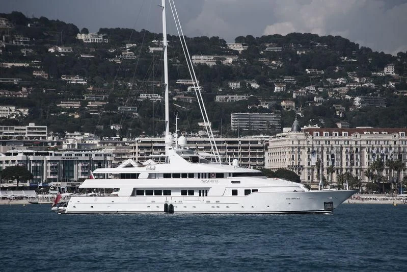 a white boat in the water aboard TACANUYA Yacht for Charter