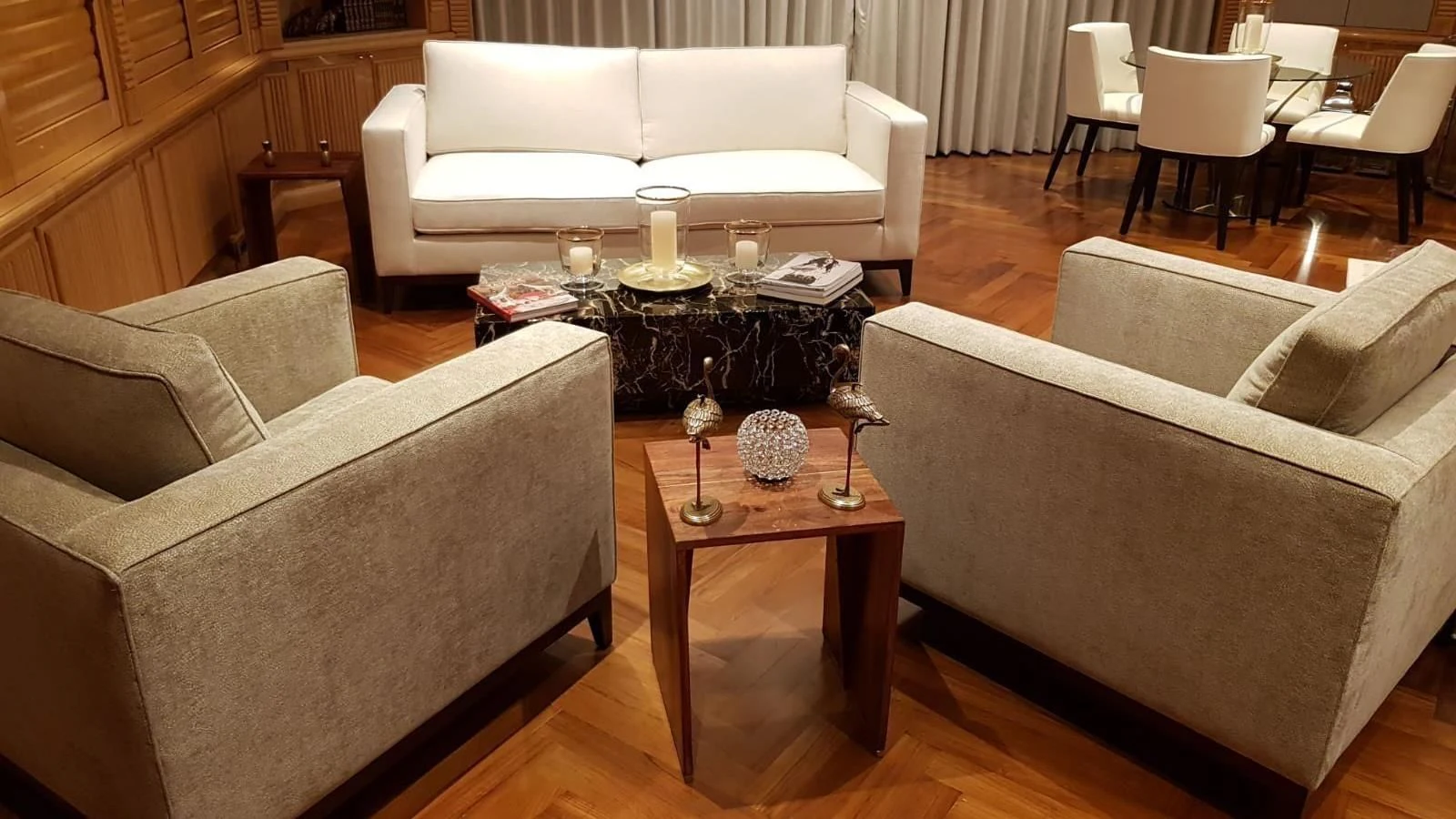 a living room with a couch and a coffee table aboard TACANUYA Yacht for Charter