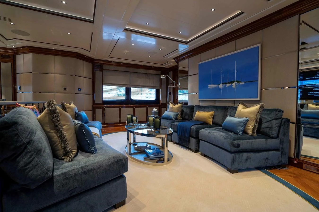 a living room with a couch and a tv aboard TACANUYA Yacht for Charter