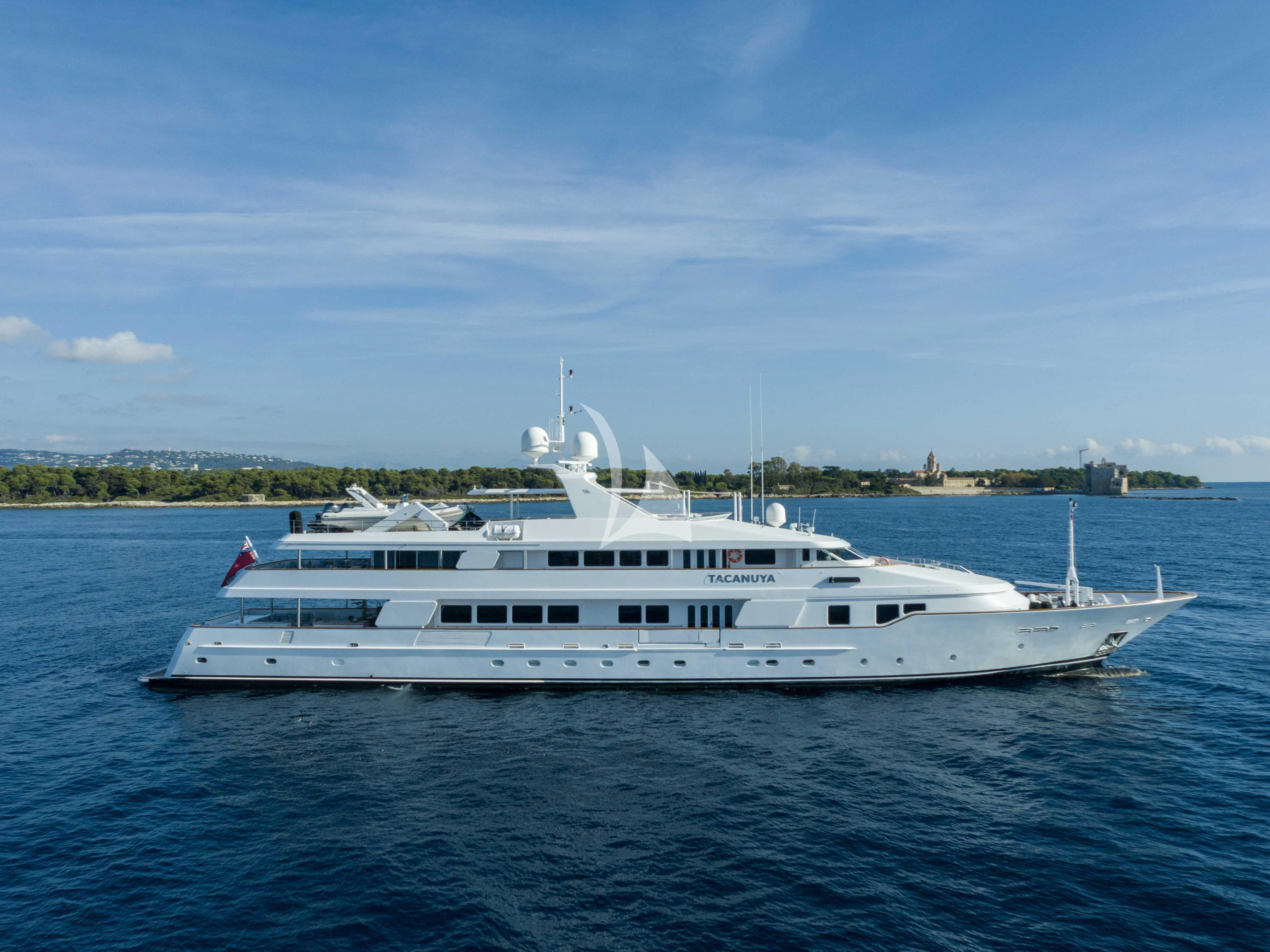 a white yacht in the water aboard TACANUYA Yacht for Charter