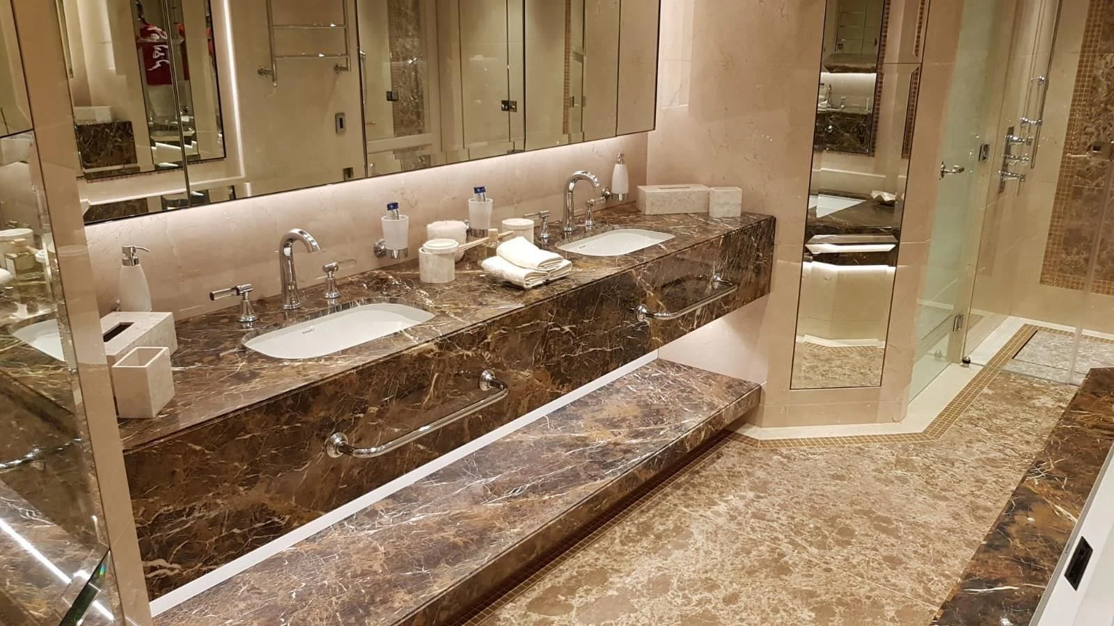 a bathroom with a countertop sink and a large mirror aboard TACANUYA Yacht for Charter
